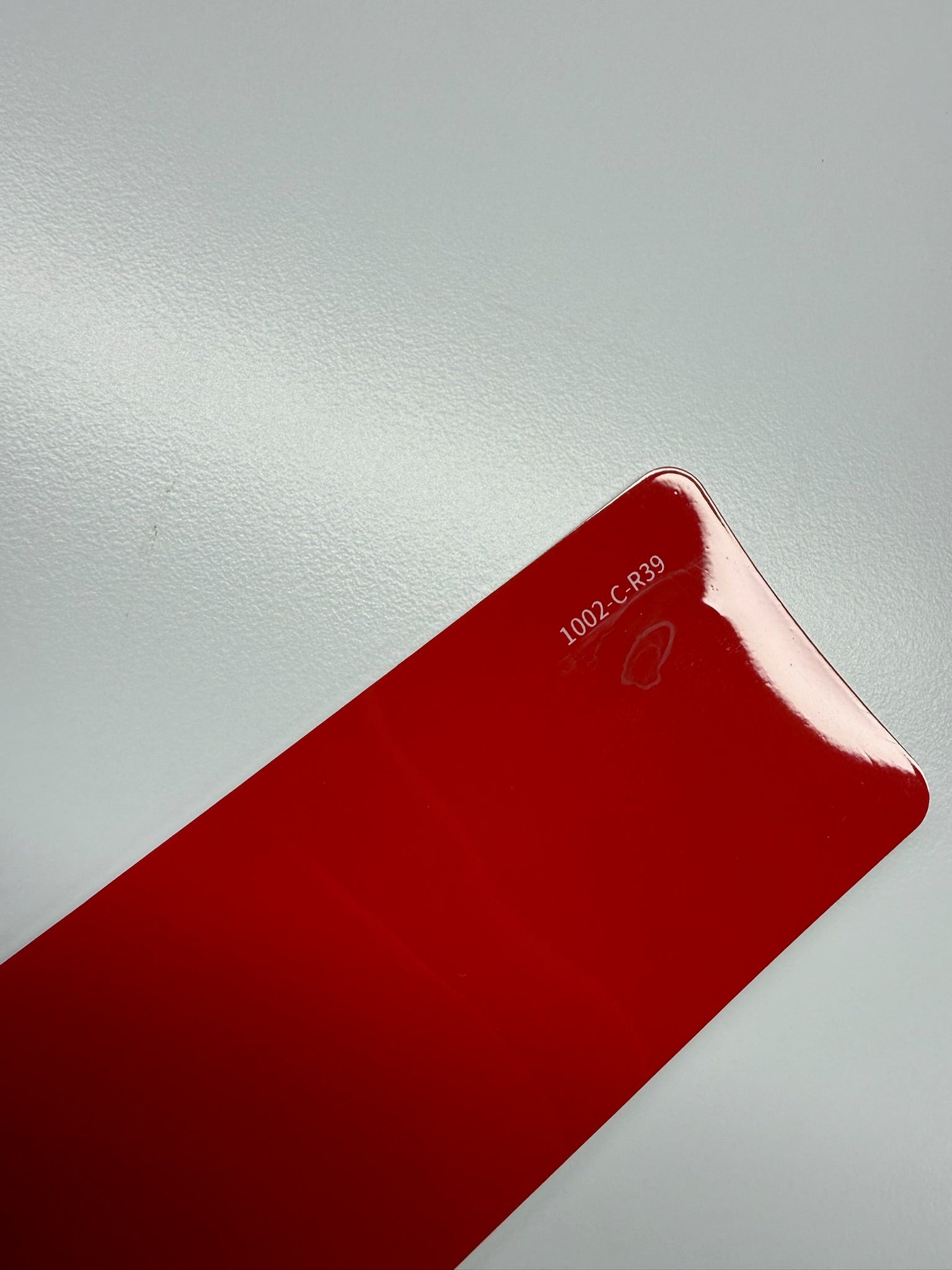 AUREON Crystal Ferrari Red color PPF film swatch
