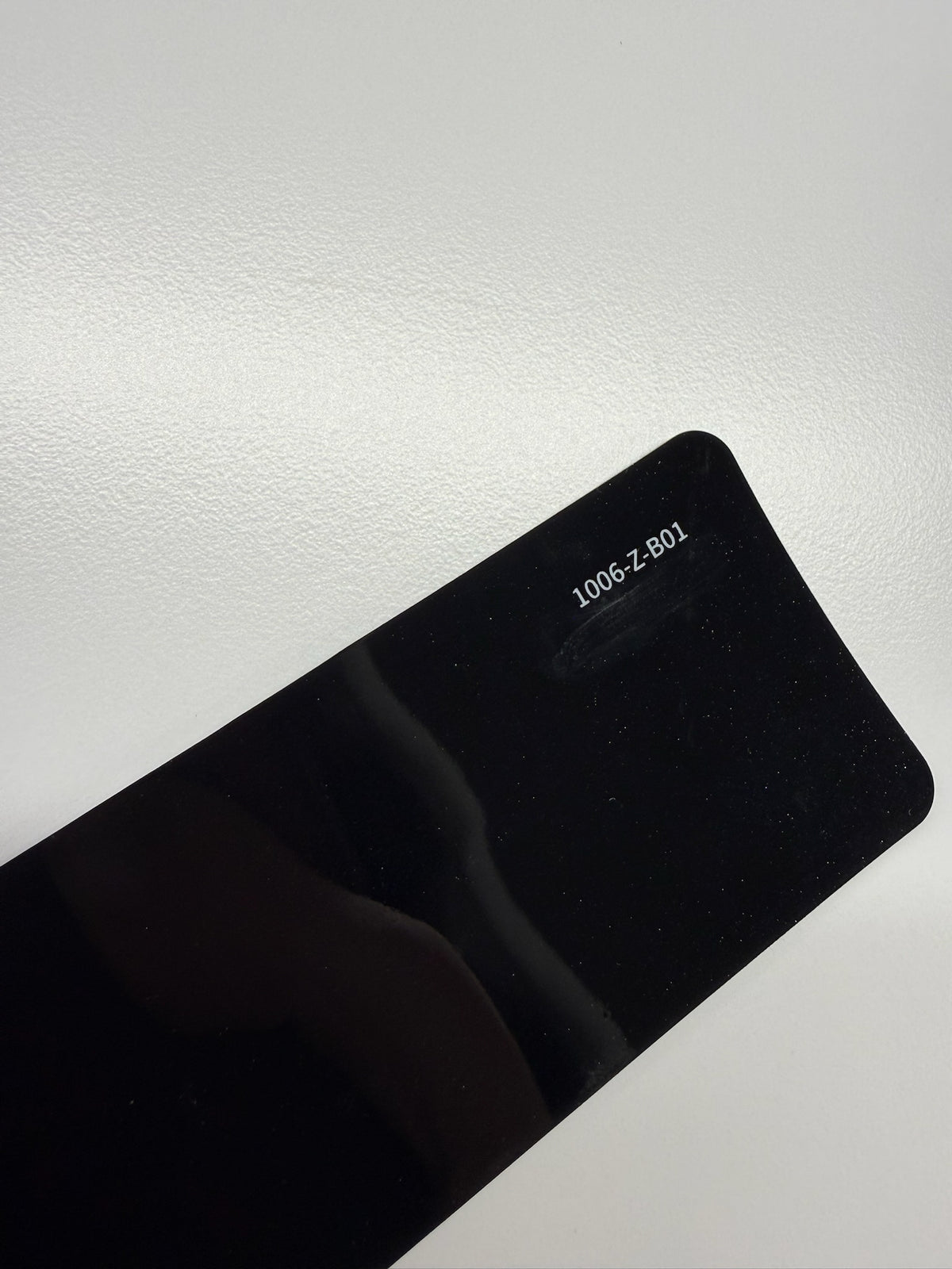 AUREON Santorini Black color PPF film swatch